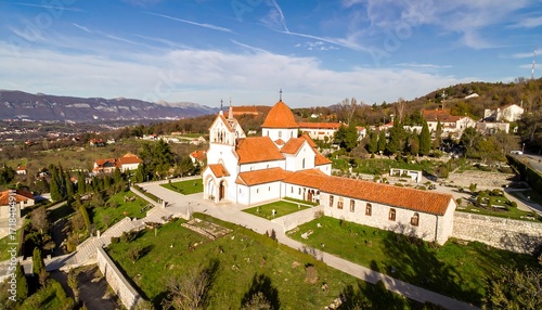 Panoramic view of a church nestled in a hillside town
