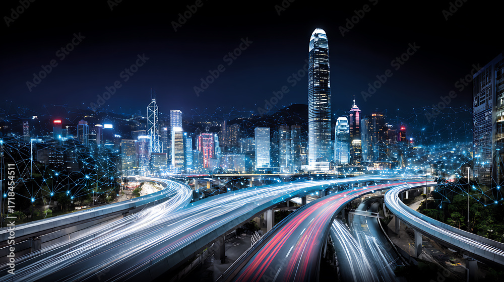 Obraz premium Nighttime cityscape with illuminated skyscrapers and light trails from moving vehicles on elevated highways