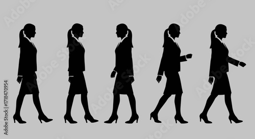 Silhouette sequence of a businesswoman walking in professional attire against a gray background studio shot