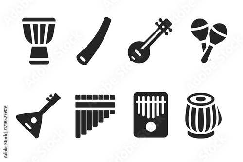 Ethnic Instrument Icons. Solid, filled icon set of ethnic musical instruments: djembe drum, didgeridoo, sitar, maracas, balalaika, pan flute, kalimba, tabla.
