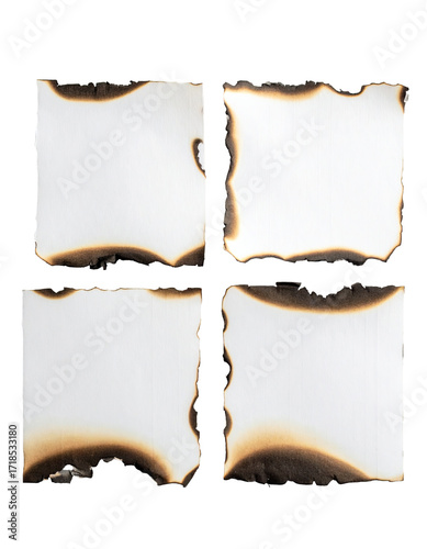 Four burnt paper squares, arranged in a grid.  Each square displays charred edges and a blank white center