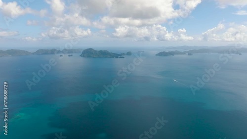 Wallpaper Mural Aerial view of serene sea surface and tropical islands surrounded by coral reefs. Torontodigital.ca