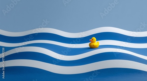 Minimalist composition of blue and white horizontal waves with a yellow rubber duck against a clean white background, high-resolution style image evoking calm water and playful bath time concept