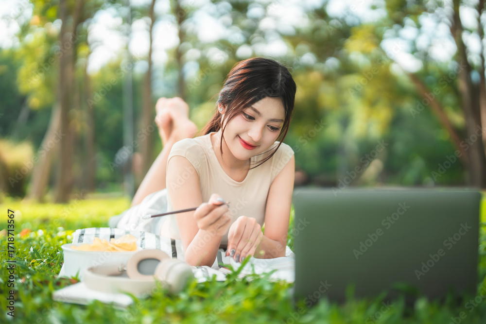 custom made wallpaper toronto digitalA young woman enjoys spending time writing and reading in the park.