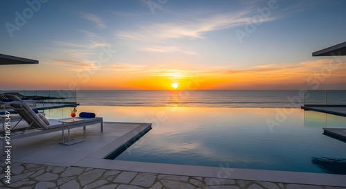 Luxury travel concept: infinity pool overlooking ocean sunset at a 5-star resort, minimalistic aesthetic, ultra realistic, professional commercial shot