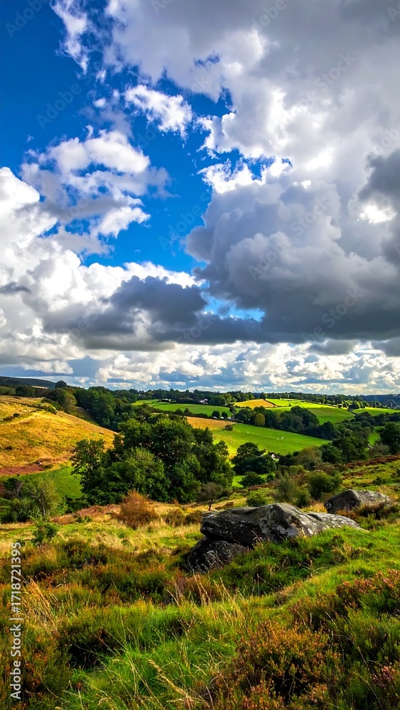 Fototapeta premium Panoramic view of a landscape with hills, trees, and clouds