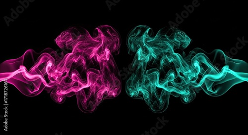 Vibrant pink and teal smoke plumes swirl dynamically against a stark black background creating an abstract, energetic visual perfect for modern design projects.