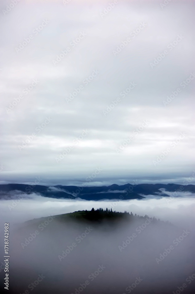 Fototapeta premium Peaceful tranquil landscape with fog over the mountains
