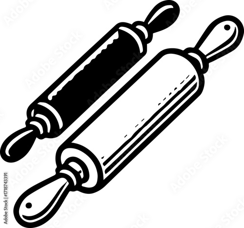 Two rolling pins one in black and one in white used for baking and cooking in the kitchen tool set