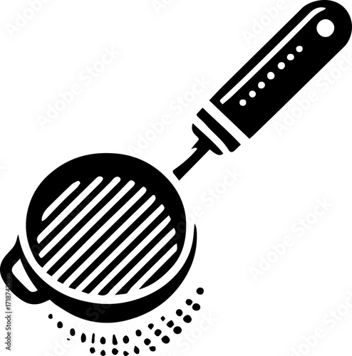Black and white illustration of a round sieve with a handle and small particles falling from it