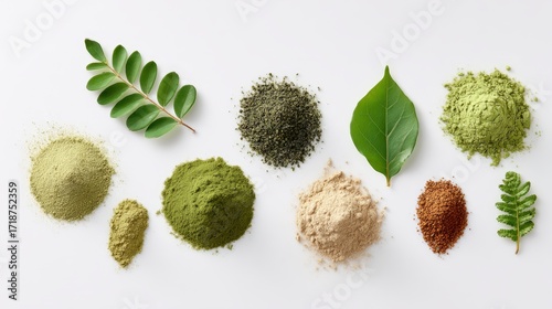 Various organic superfood powders with fresh green leaves are displayed beautifully on a clean white surface in an overhead studio shot.