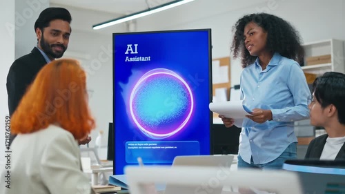 Diverse creative team use Ai Assistant (artificial intelligence assistant) on AI-assisted display for Marketing Data Analyst meeting at office.Coding team,develop Ai Assistant,business brainstorming