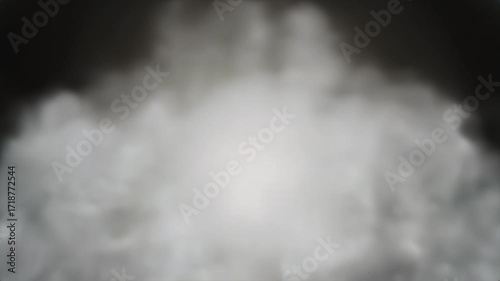 Abstract cloud-like form of gray and white smoke against a dark background.