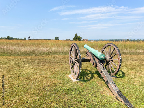 Smoothbore Cannon Points Across Field at Statue in Manassas National Battlefield Park