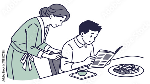 A woman assists a young man reading a newspaper at a table with breakfast.