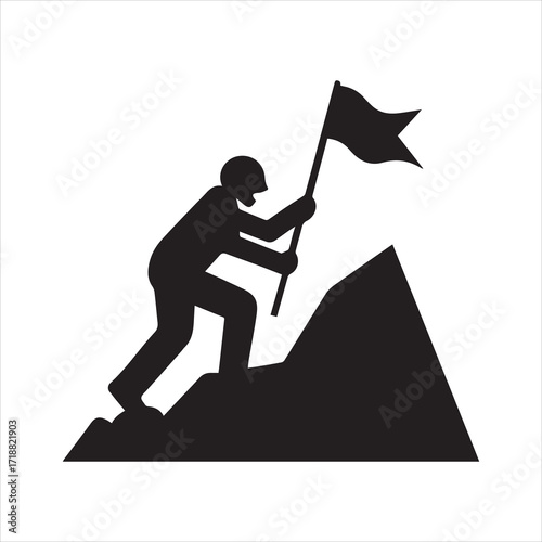Silhouette of a person planting a flag on a mountain peak