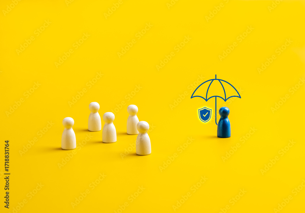 Φωτογραφία Insurance and protection concept with blue figure under umbrella icon separated from group of white figures on yellow background, symbolizing life insurance, health coverage, and individual security