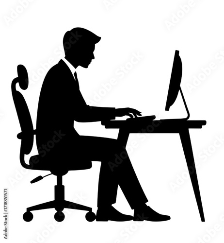 Silhouette of a Businessman Working on a Computer