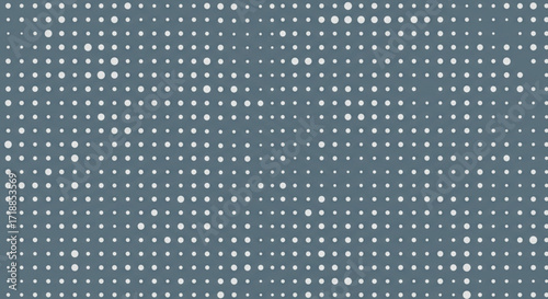 Abstract gray background with a repeating pattern of varying-sized white dots.