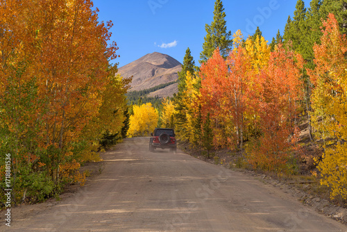 Exploring Autumn Back-country Road - A SUV driving on a scenic back-country road, near the summit of Boreas Pass, on a sunny Autumn evening. Como-Breckenridge, Colorado, USA.