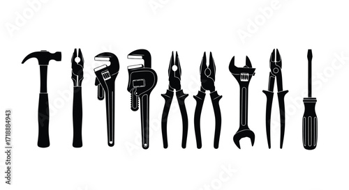 Vector illustration of illustration of collection of silhouetted hand tools on a