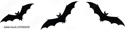 Three bats silhouetted against a full moon create a spooky halloween atmosphere