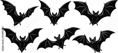 Spooky black bat silhouettes flying against a white background for halloween decor