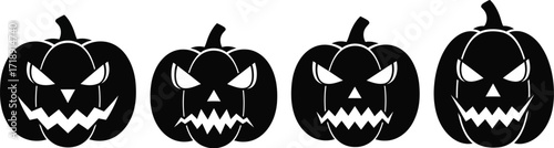 Four black halloween pumpkins with scary faces on a white isolated background