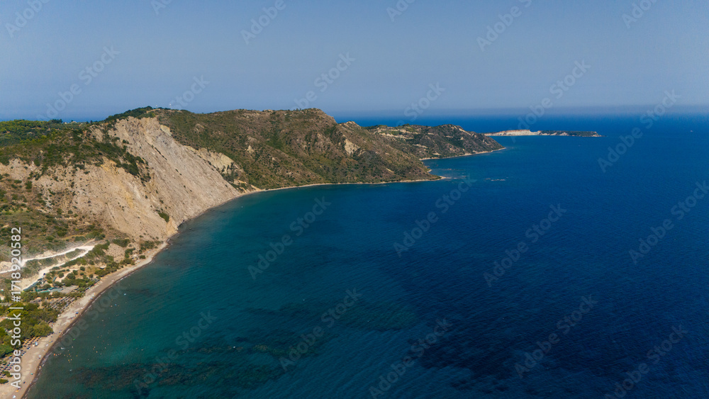 Obraz premium Paralia Dafni Beach Zakynthos Greece aerial view of sandy shoreline with turquoise Ionian Sea and dramatic coastal
