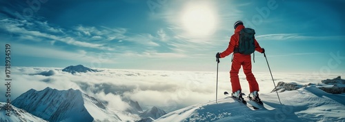 Skier Enjoying Breathtaking Mountain Views on a Sunny Winter Day