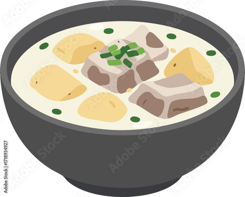 A black bowl of creamy white stew with chunks of meat, potatoes, and green herbs.