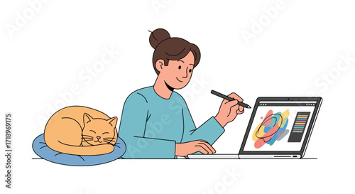 Young woman creating digital art on her laptop, while her feline companion peacefully dozes on a comfortable pillow beside her workspace