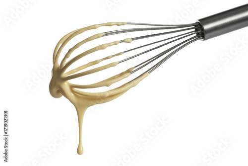 A metal whisk with creamy sauce dripping down, isolated on a transparent background. background removed