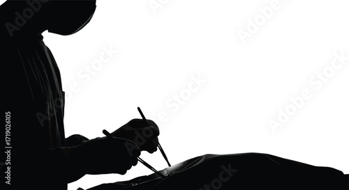 Surgeon performing an operation in silhouette with surgical tools in a sterile operating environment on white background