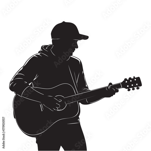 Silhouette of male musician playing acoustic guitar