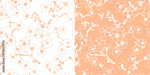Seamless pattern of delicate cherry blossom branches with white and peach flowers on white and peach backgrounds