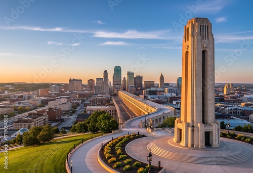 Iconic liberty memorial tower overlooks the vibrant kansas city skyline at sunset