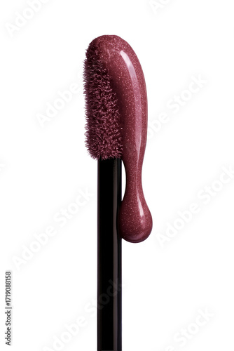 Glittering berry lip gloss dripping from applicator, beauty product close up.