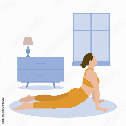 Woman Doing Cobra Pose in Yoga Class
