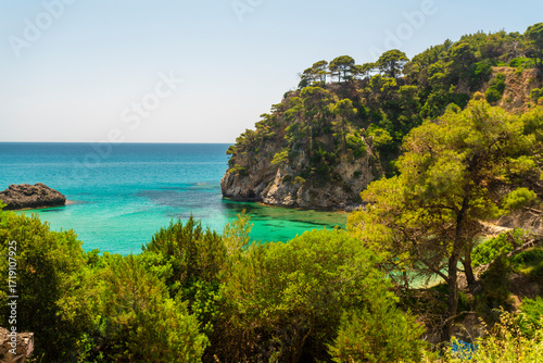 Turquoise cove sheltered bay with cliffs in Kanallaki greece