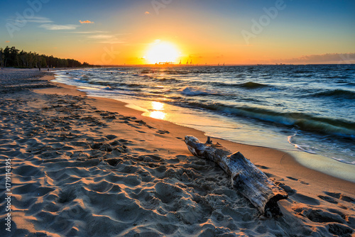 Fototapeta Naklejka Na Ścianę i Meble -  Sunset over the Baltic Sea beach in Gorki Zachodnie, Gdansk. Poland