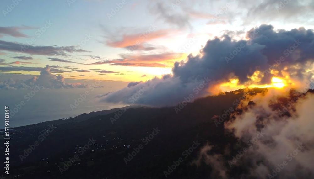 Fototapeta premium Sunrise over a misty mountain range