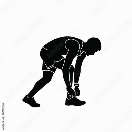 Athlete preparing for race by tying shoelaces before competition start