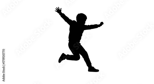 Silhouette of a person midjump arms outstretched in a celebratory pose