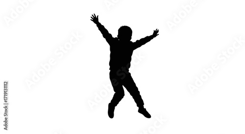 Silhouetted boy leaps arms raised appearing joyful against a white background
