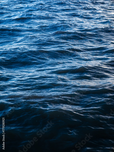 Deep Blue Ocean Water Waves Surface with Silver Light Reflection - Abstract Sea Texture Background Pattern