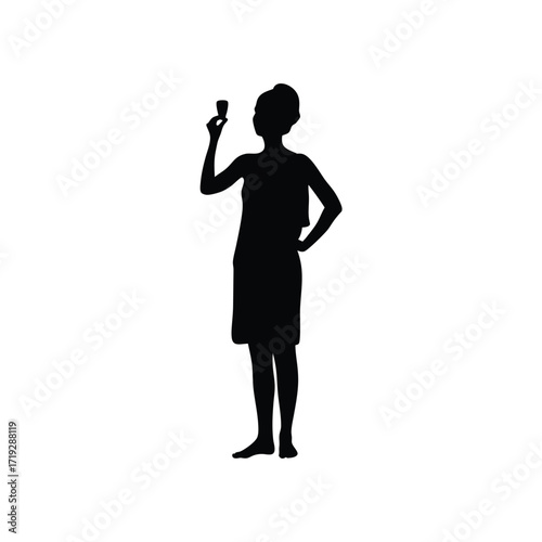 Silhouette of a woman in a robe holding a small glass with hand on hip against white backdrop