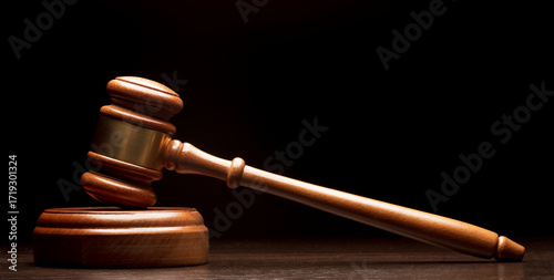 Wooden gavel on black background