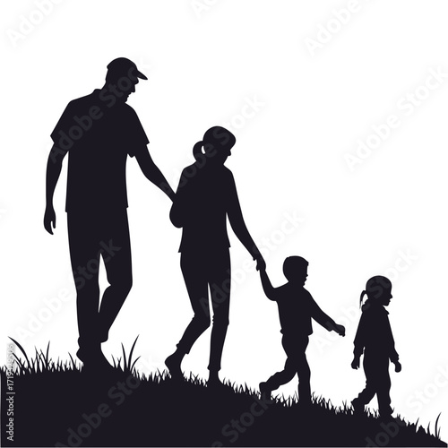 A family of five silhouetted while walking together on a hillside