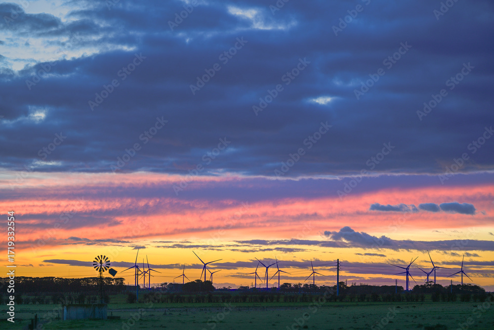 Fototapeta premium Dramatic sunset clouds over the agricultural field, Noorat, Victoria, Australia
